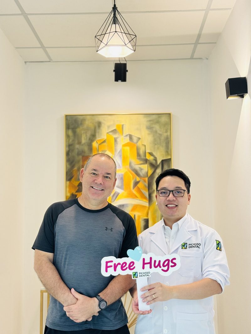 Happy patient after dental treatment at Picasso Dental Clinic